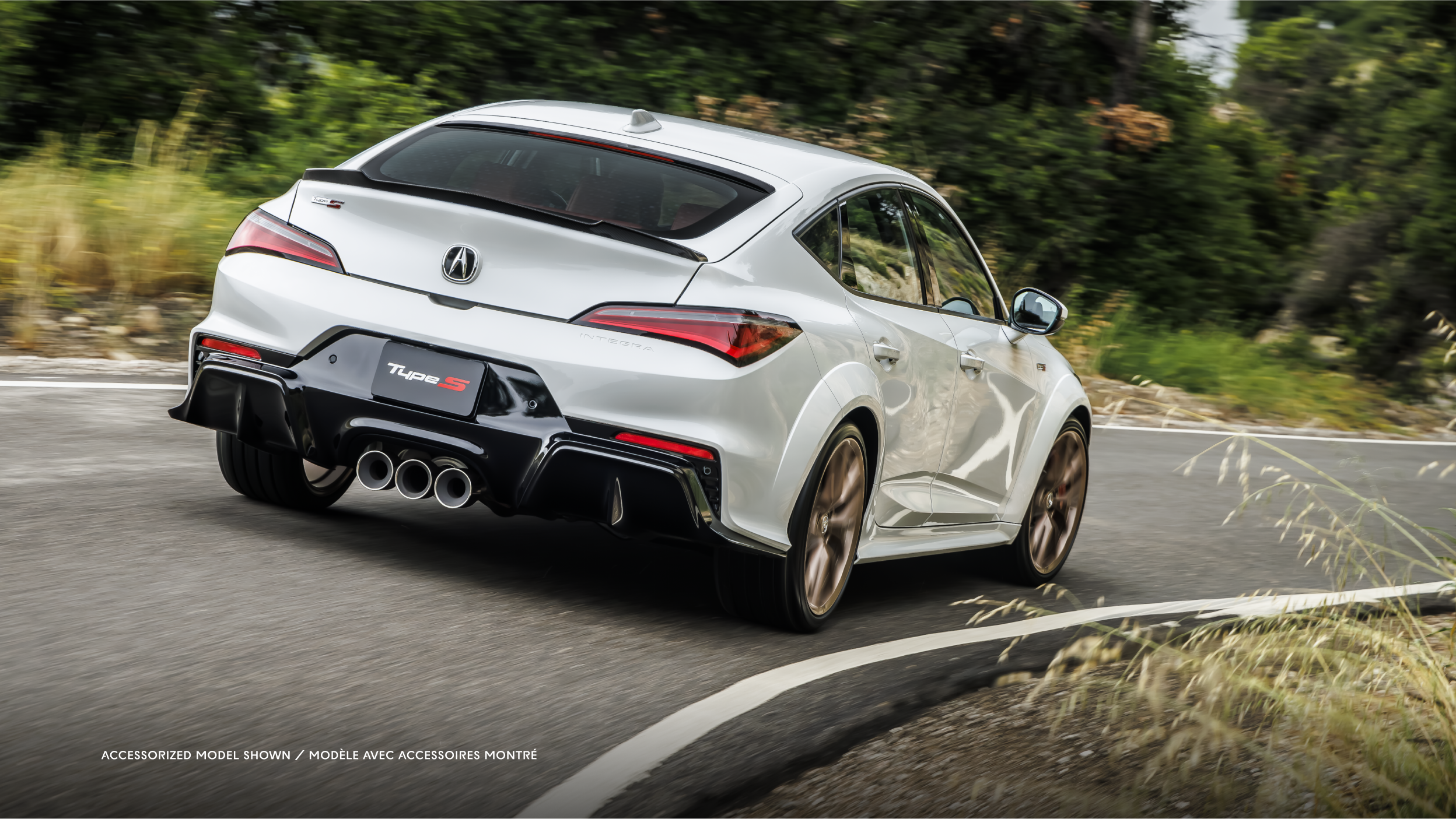 Rear left side angle of 2023 Integra in motion in dark tunnel